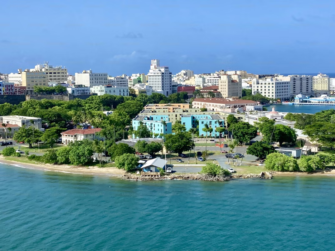 The busy waterfront area of Port Louis with colourful buildings and boats